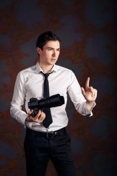 Photographer with camera in studio Stock Photos