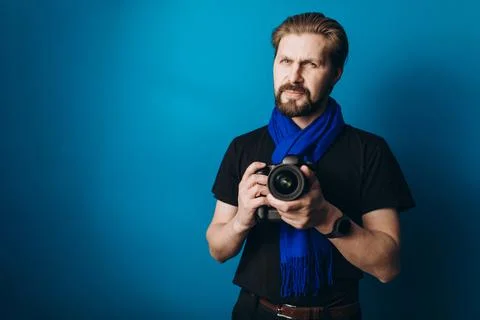Photographer with camera in studio Stock Photos