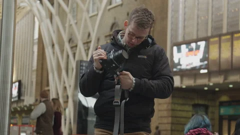 Photographer With Camera In Train Station Stock Footage 147936889