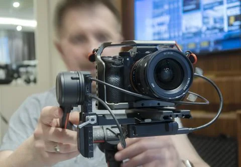 Photographer with a camera at work, close-up. Stock Photos