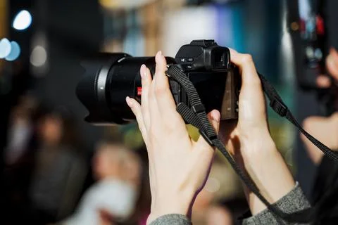 Photographer capturing image with digital camera and lens Stock Photos