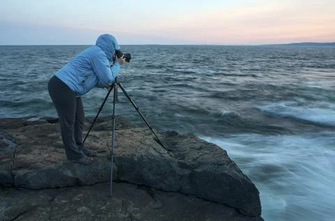 Photographer capturing a sunset Stock Photos
