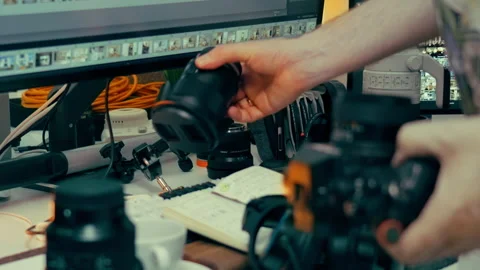 Photographer changing camera lens Stock Footage 336099392
