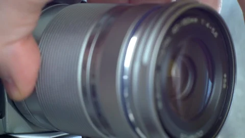 Photographer changing lens on camera. Stock Footage 103351984