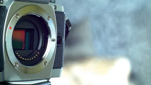 Photographer changing lens on camera. Stock Footage 103351991