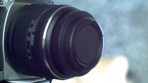 Photographer changing lens on camera. Stock Footage 103352010