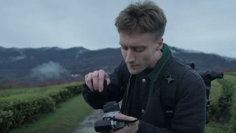 Photographer cleaning the lens. Preparing camera for shooting Stock Footage 150688870