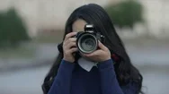 Photographer Covering Her Face With The Camera. Woman With Photocamera Stock Footage