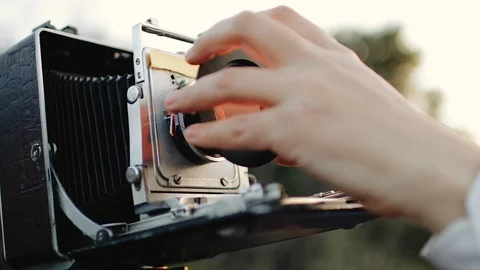 Photographer customizes large format camera before shooting Stock Footage 106320714
