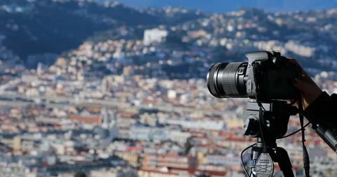 Photographer With DSLR Camera On Tripod Taking The Urban Landscape Of Nice Stock Footage 102769009