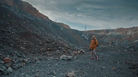 Photographer explores rugged mountain range Stock Footage 149673725
