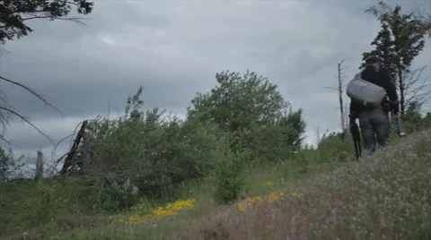 Photographer exploring landscape Stock Footage 44350984