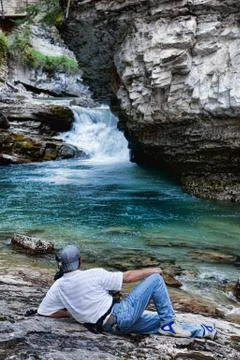 Photographer by falls Stock Photos