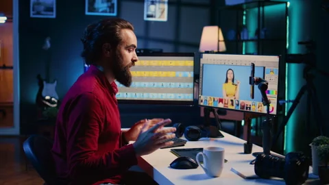 Photographer filming online tutorial on how to use photo editing software Stock Footage 257500200