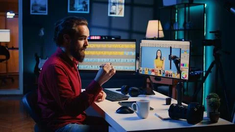 Photographer filming online tutorial on how to use photo editing software Stock Photos