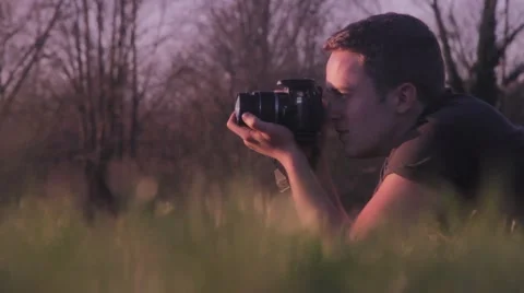 Photographer in grass flat mode Video stock 48896811
