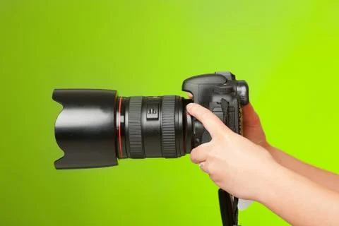 Photographer hands with camera Stock Photos