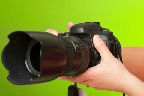 Photographer hands with camera Stock Photos