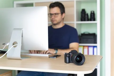 Photographer in his office working on the computer Stock Photos