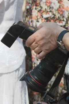 Photographer holding a the camera Stock Photos