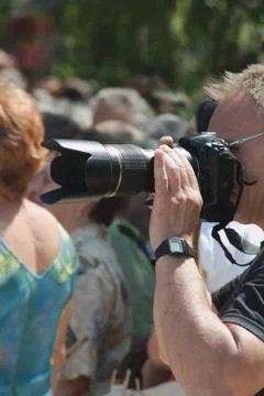 Photographer holding a the camera Stock Photos