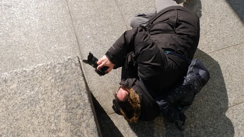 Photographer laying on ground taking creative photo 2 Video stock 87709300