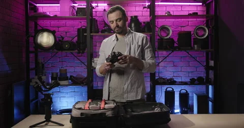 Photographer makes a camera review for vlog. Professional photographer shows Stock Footage 274084569