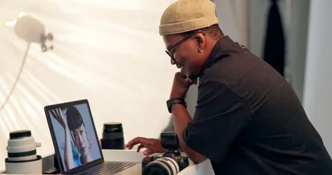 Photographer, man and editing in studio with laptop, retouching image or picture Stock Footage 329377825