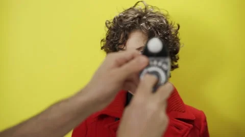 Photographer measures light blocks model face she moves to stay in the spotlight Stock Footage 147328700