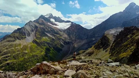 Photographer in the mountains Stock Footage 239551690