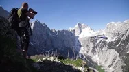 Photographer Photographing Snow Covered Mountains In Slow Motion Stock Footage