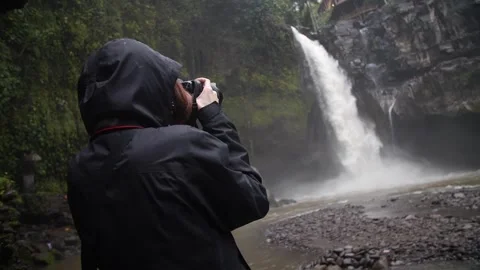 Photographer in the rain Stock Footage 268822243
