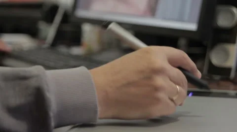 Photographer retouching image, using a digital tablet and stylus pen. Stock Footage 58942728
