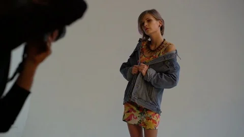 Photographer shooting model at studio Stock Footage 70770077