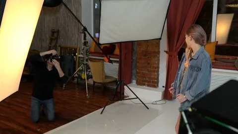 Photographer shooting model at studio Stock Footage 70770360