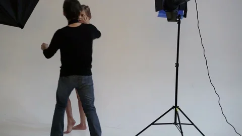 Photographer shooting model at studio Stock Footage 70772750