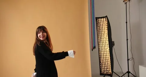 Photographer shooting model in studio with softboxes Stock Footage 279914880