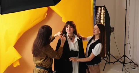 Photographer shooting model in studio with softboxes Stock Footage 279915448