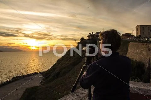 Photographer Shooting Sunset Stock Photos