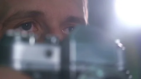 Photographer shoots on an old camera in the studio Stock Footage 73682778
