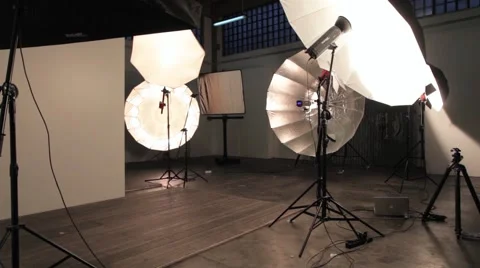 Photographer Silhouette in Photographic Studio with a big Umbrella Stock Footage