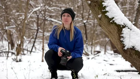 Photographer in the snow Stock Footage 147748974