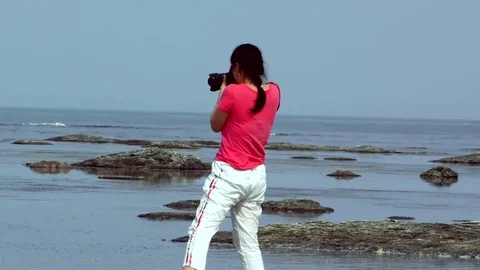 The photographer stands on the reef Stock Footage 77457204