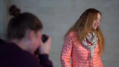 Photographer in studio, shooting beautiful model Stock Footage 73530641