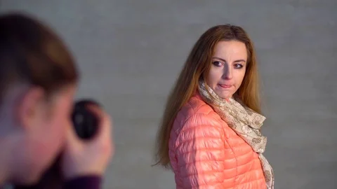Photographer in studio, shooting model. Close-up Stock Footage 73531748