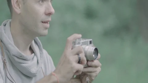 Photographer takes pictures with camera. Stock Footage 94486053