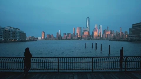Photographer taking Pictures of Panoramic view of Manhattan at night 4k Stock Footage 106942872