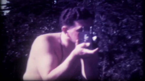A photographer tries out his new camera 1950s vintage film home movie 1298 Stock Footage 44063620