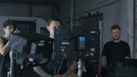 Photographer using amplifier, while director setting up a scene Video stock 198274362