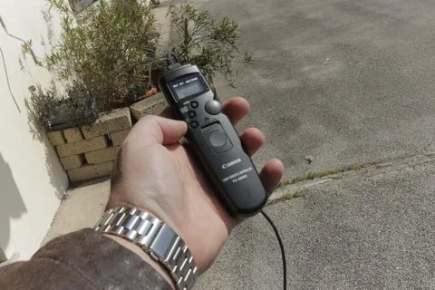 Photographer using canon timer remote controller tc-80n3 Stock Photos